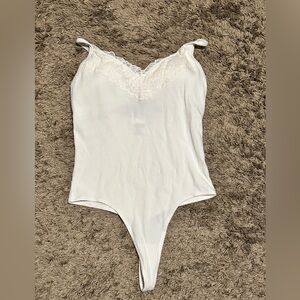 White bodysuit from pink